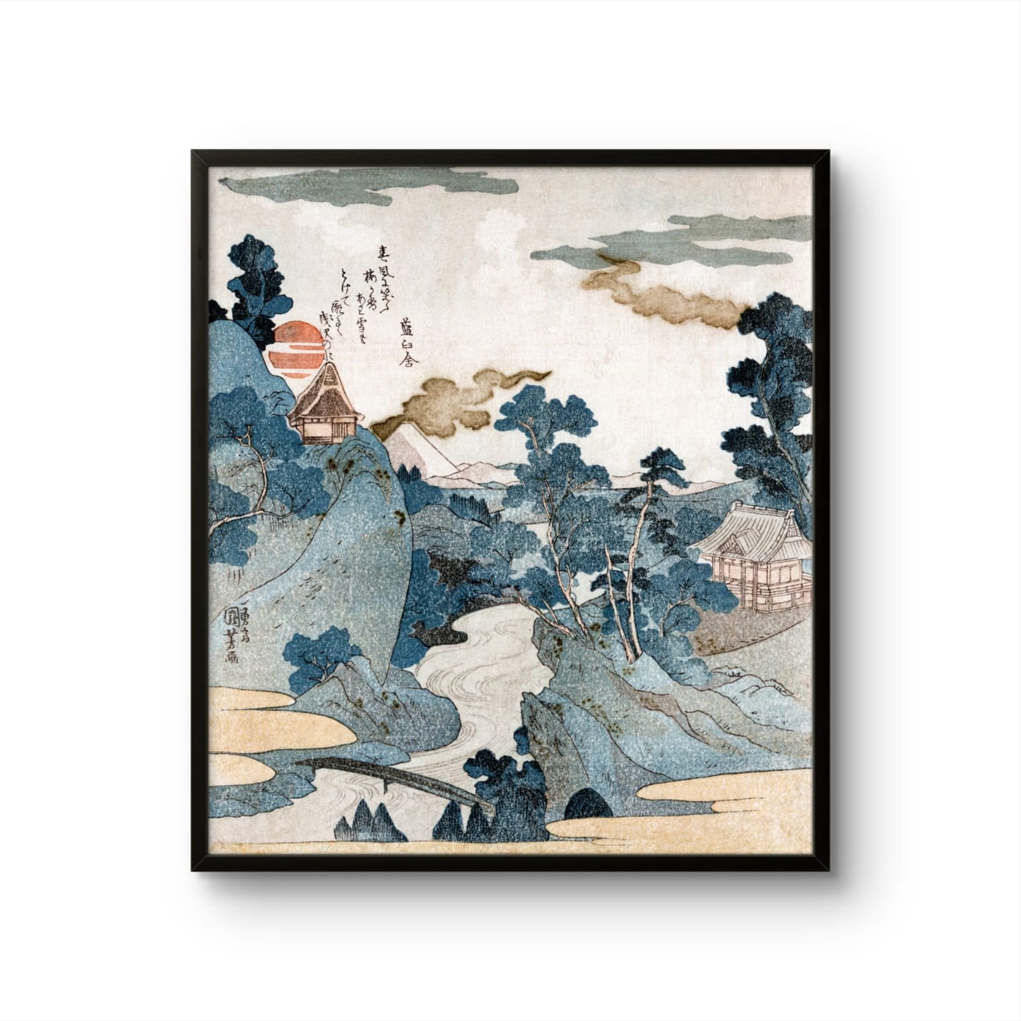 Framed artwork of a traditional Japanese landscape with mountains and houses.