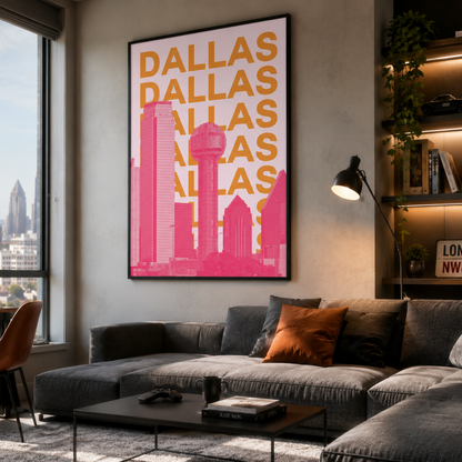 A framed vertical art print featuring a pink and orange Dallas skyline with the word 'DALLAS' repeated in large orange letters, displayed on a wall in a modern living room setting.