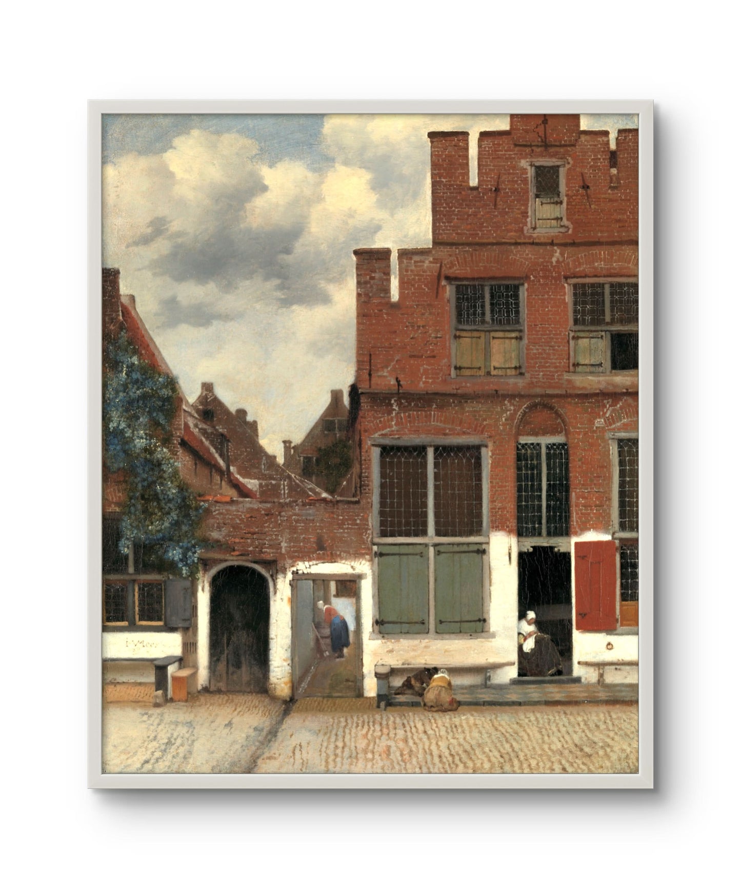 Framed artwork of a street scene with buildings and people, reminiscent of classical painting style.