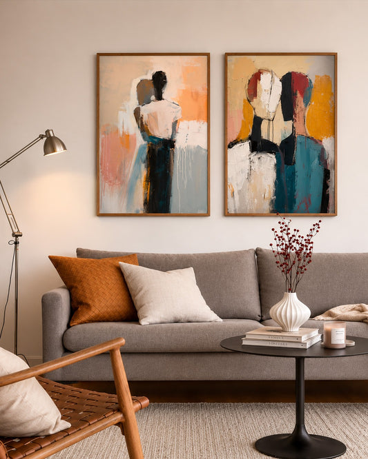 Living room with a gray sofa, abstract art on the wall, and decorative items.
