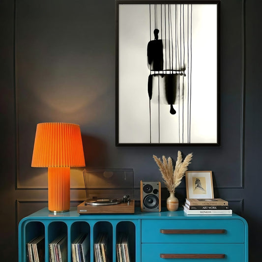 Blue console table with vinyl records, orange lamp, and decor items against a dark wall.