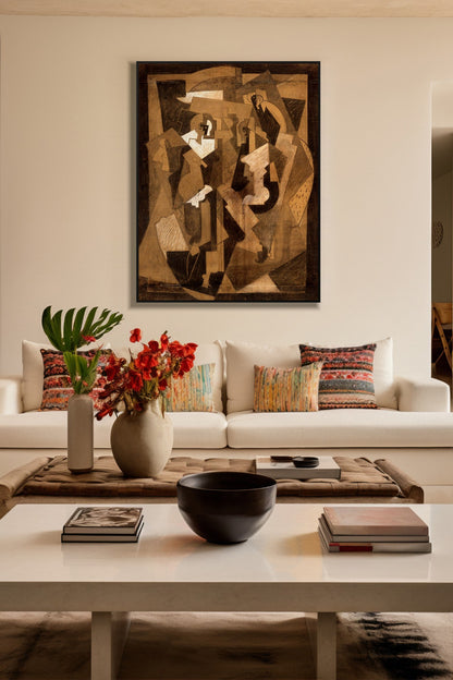Cubist Conversations art print in a black frame above a cream sofa