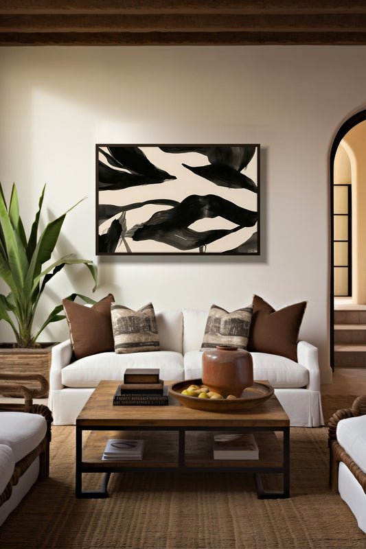 Ink Currents framed abstract art above a white sofa in a warm Mediterranean living room
