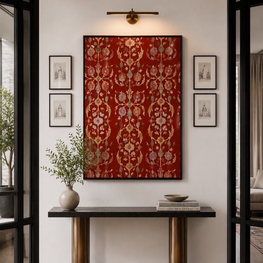A large framed red tapestry with an ornate gold and beige damask pattern hangs on a white wall above a console table in a modern interior setting.