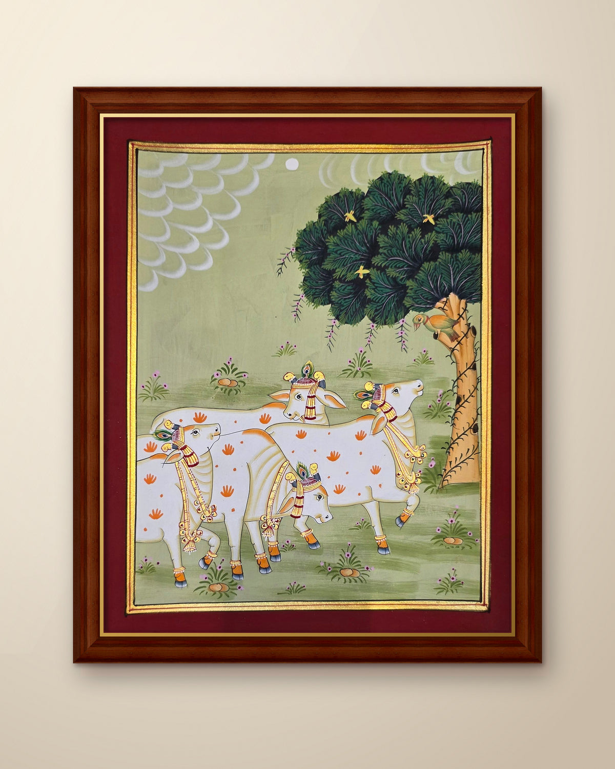 Gaumata Grazing Under the Kadamb - Sage Pichwai shown in a walnut wood frame (frame sold separately)