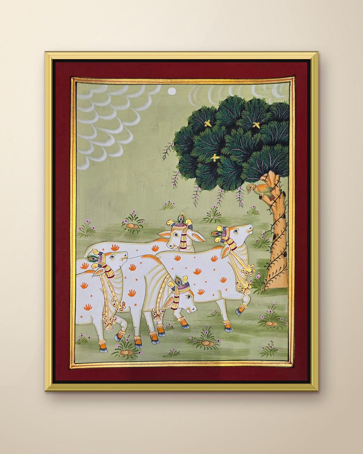 Gaumata Grazing Under the Kadamb - Sage Pichwai shown in a gold metal frame (frame sold separately)