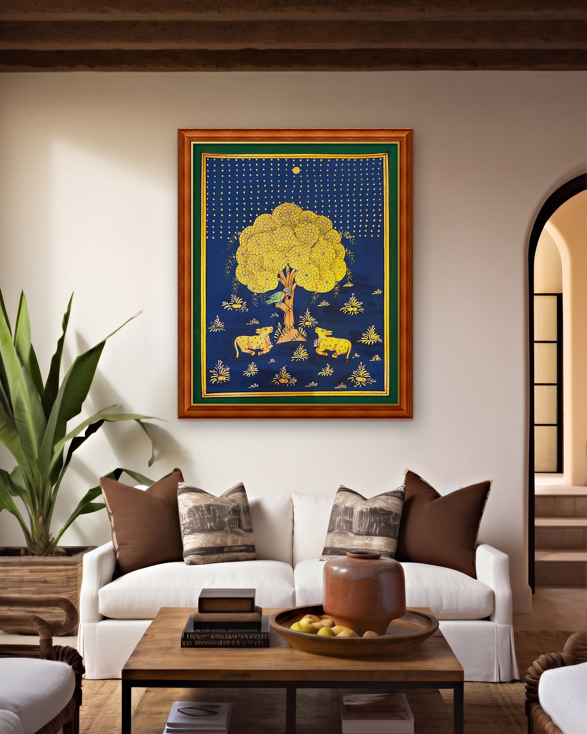 Golden Kadamb Night - Navy Pichwai styled on a wall in a teak wood frame (frame sold separately)
