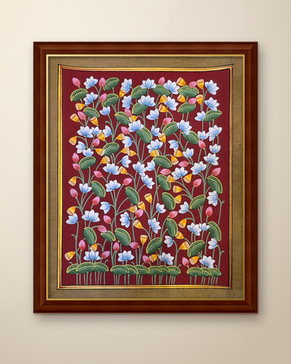Kamal Van Lotus Garden - Maroon Pichwai shown in a walnut wood frame (frame sold separately)