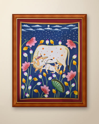 Kamdhenu in the Lotus Pond - Navy Pichwai shown in a teak wood frame (frame sold separately)