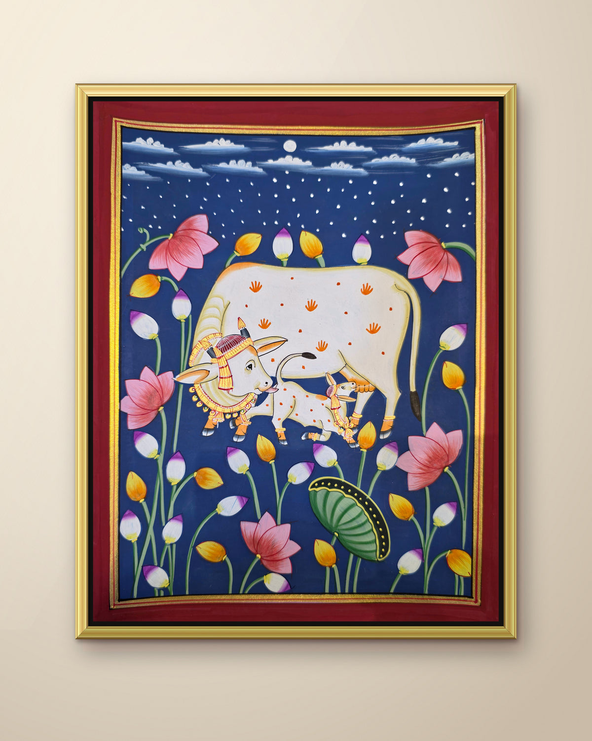 Kamdhenu in the Lotus Pond - Navy Pichwai shown in a gold metal frame (frame sold separately)