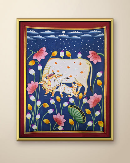 Kamdhenu in the Lotus Pond - Navy Pichwai shown in a gold metal frame (frame sold separately)