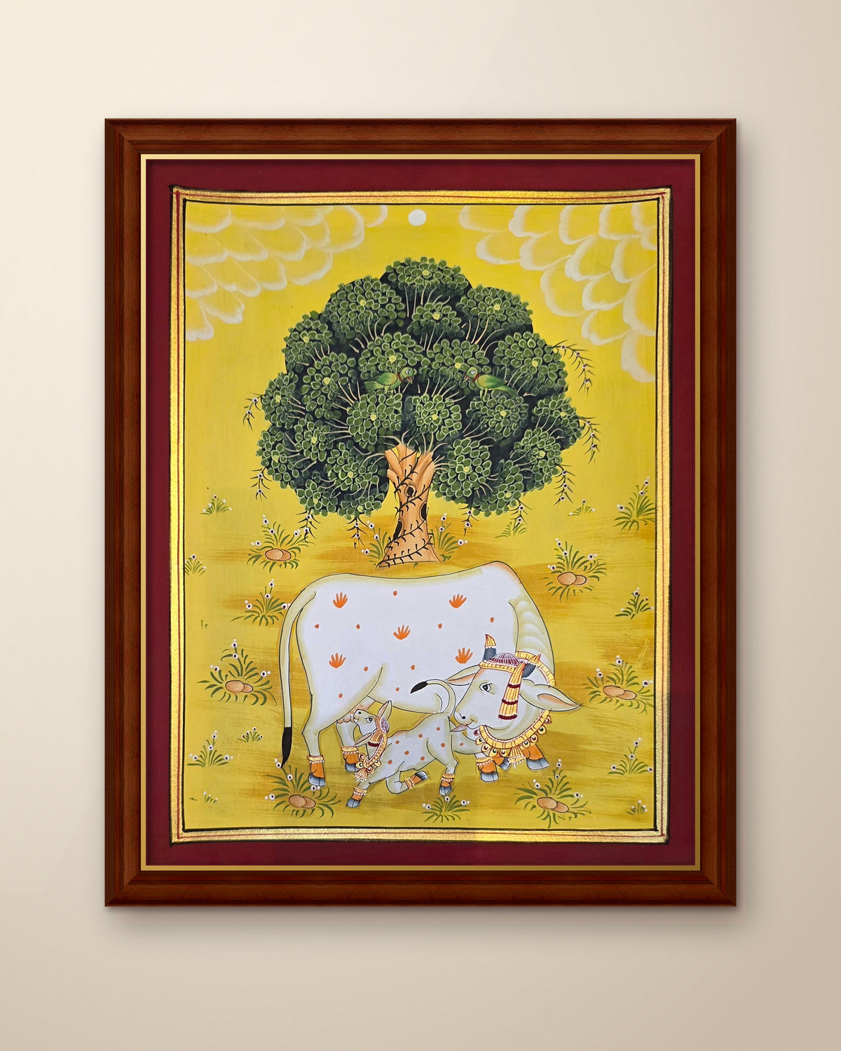 Kamdhenu Under the Kadamb Tree - Yellow Pichwai shown in a walnut wood frame (frame sold separately)