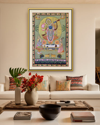 Shrinathji Darshan - Sage Pichwai styled on a wall in a gold metal frame (frame sold separately)