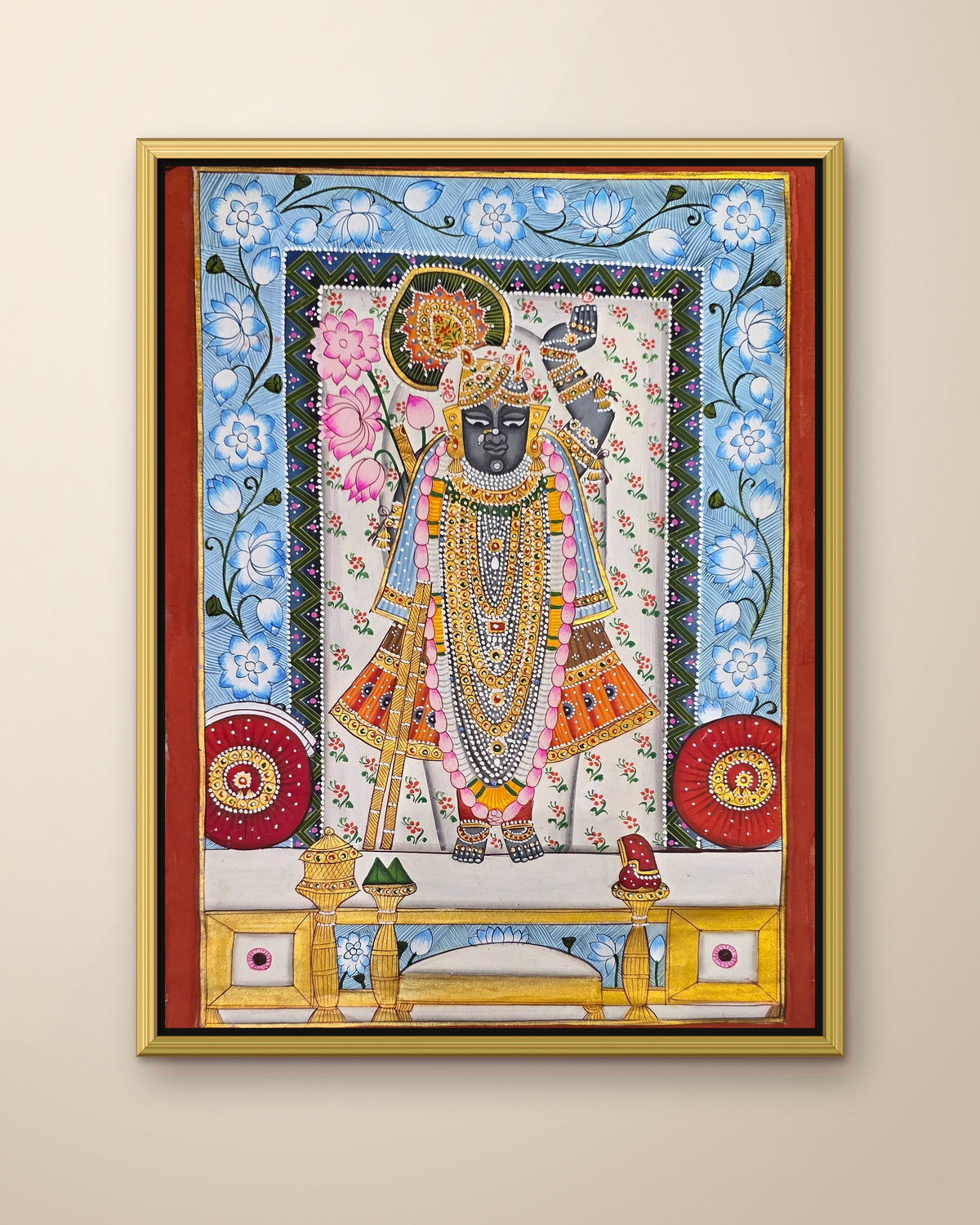 Shrinathji Phool Mandali - Ivory and Blue Pichwai shown in a gold metal frame (frame sold separately)
