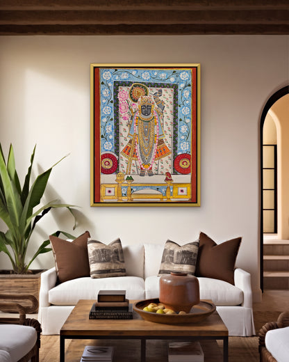 Shrinathji Phool Mandali - Ivory and Blue Pichwai styled on a wall in a gold metal frame (frame sold separately)