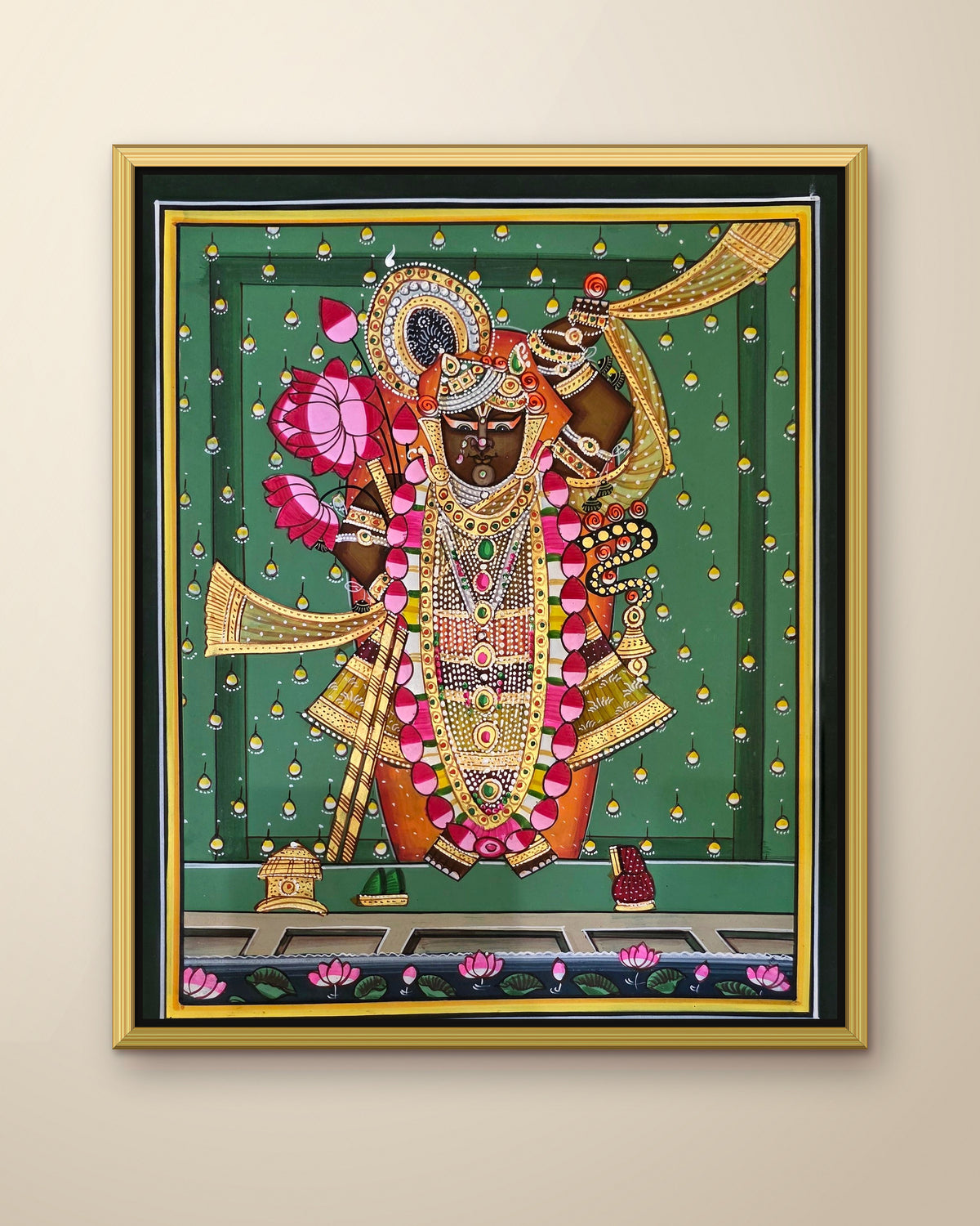 Shrinathji Shringar - Emerald Pichwai shown in a gold metal frame (frame sold separately)