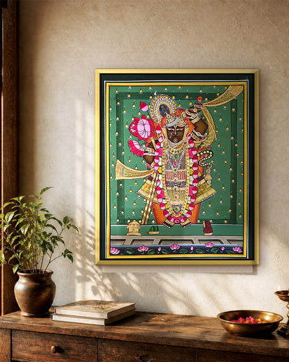 Shrinathji Shringar - Emerald Pichwai styled on a wall in a gold metal frame (frame sold separately)