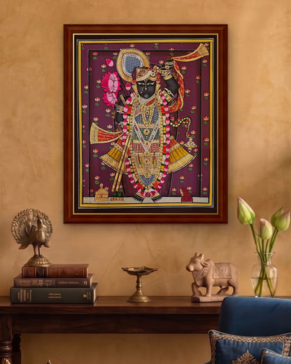 Shrinathji Shringar - Royal Plum Pichwai styled on a wall in a walnut wood frame (frame sold separately)