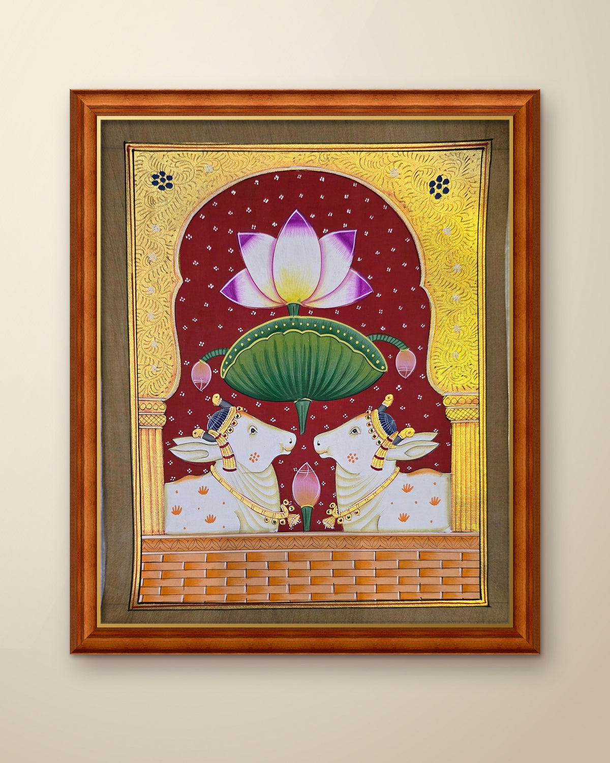 Twin Gaumata Under the Golden Arch - Maroon Pichwai shown in a teak wood frame (frame sold separately)
