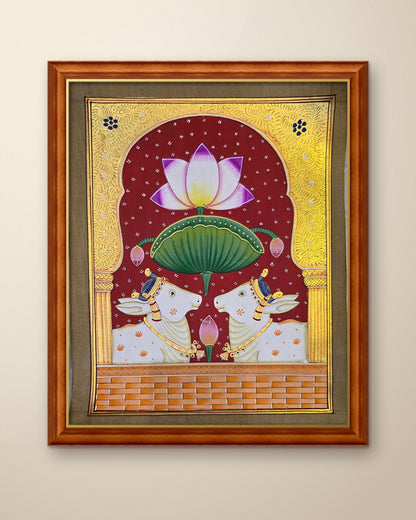Twin Gaumata Under the Golden Arch - Maroon Pichwai shown in a teak wood frame (frame sold separately)