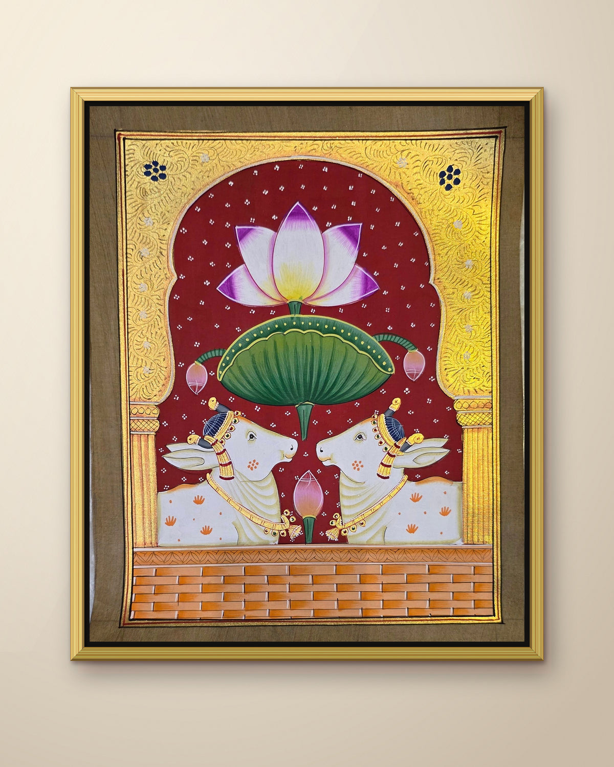 Twin Gaumata Under the Golden Arch - Maroon Pichwai shown in a gold metal frame (frame sold separately)