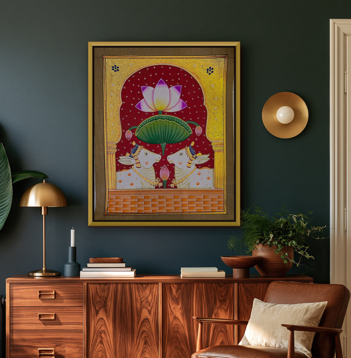 Twin Gaumata Under the Golden Arch - Maroon Pichwai styled on a wall in a gold metal frame (frame sold separately)