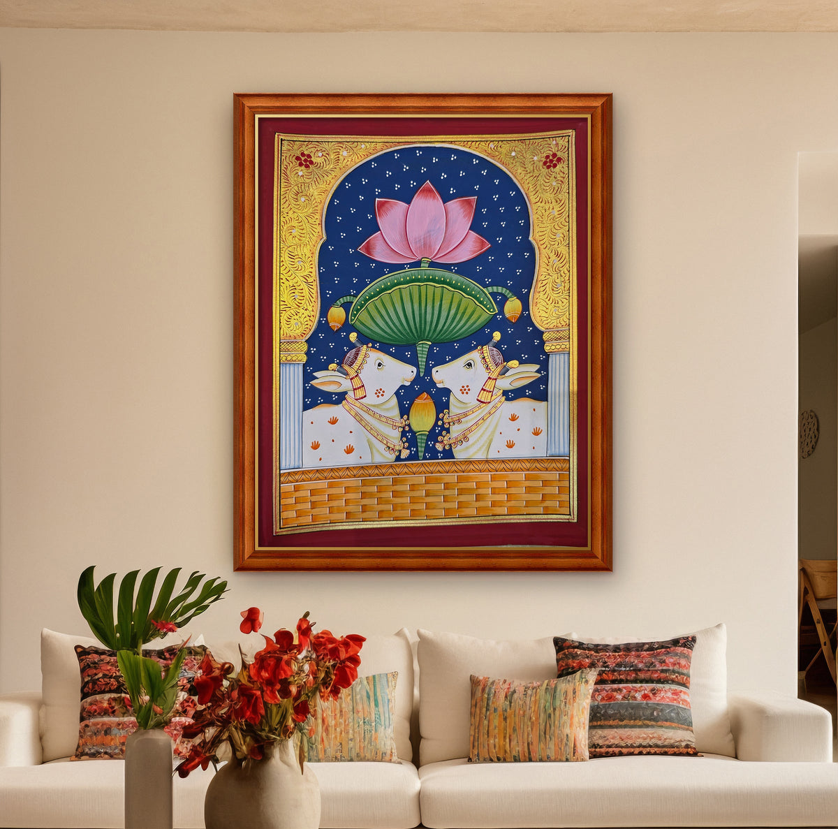 Twin Gaumata Under the Lotus Arch - Navy Pichwai styled on a wall in a teak wood frame (frame sold separately)