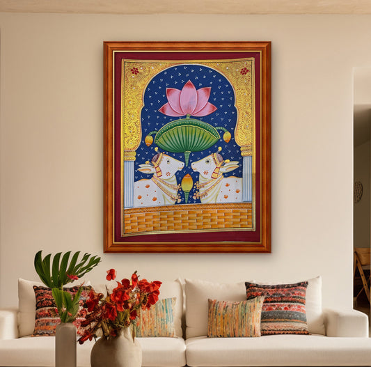 Twin Gaumata Under the Lotus Arch - Navy Pichwai styled on a wall in a teak wood frame (frame sold separately)