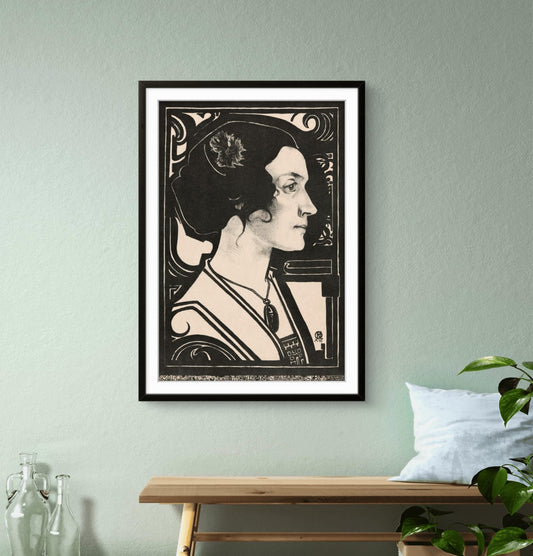 Framed artwork of a stylized portrait on a wall above a wooden bench.